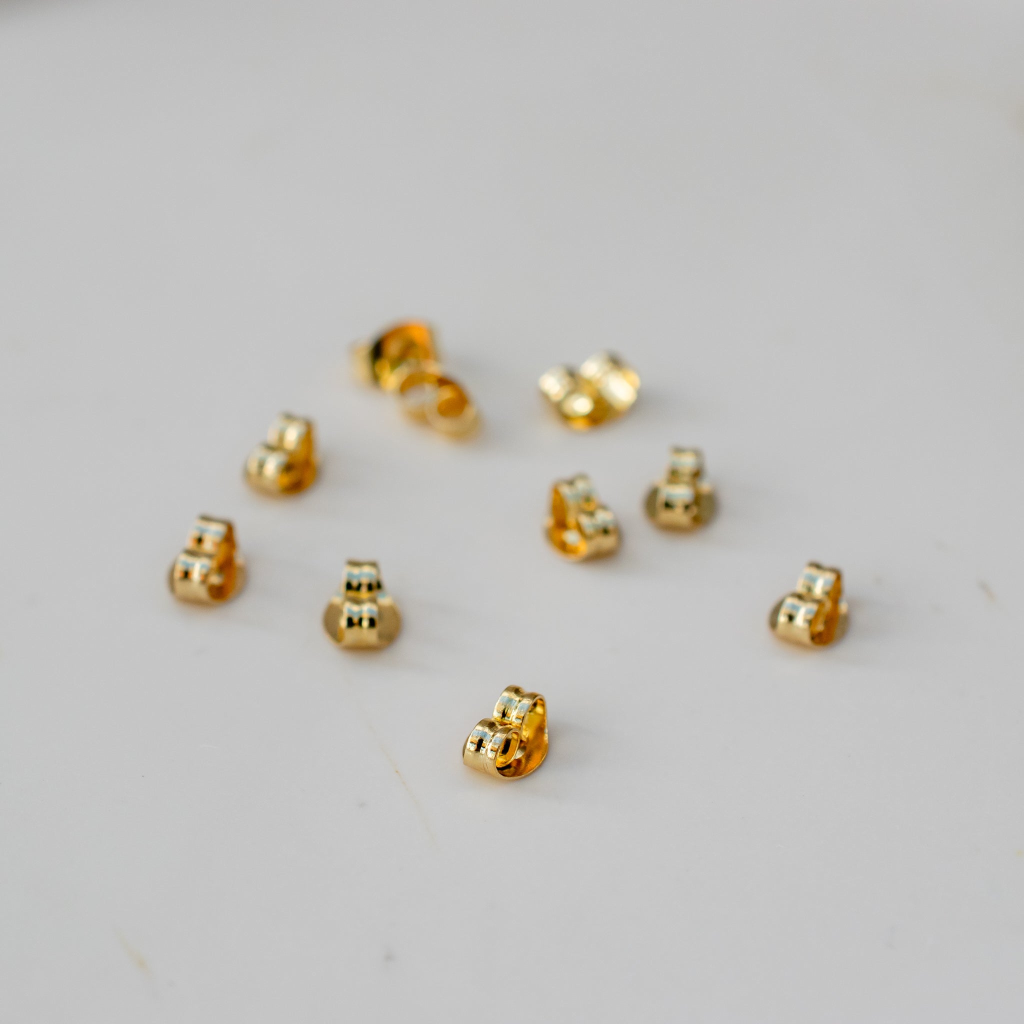 Goudkleurige RVS oorbel stoppers (5 paar)